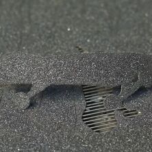 CO₂ laser system cutting complex contours with high precision into non-slip Safety Load® material